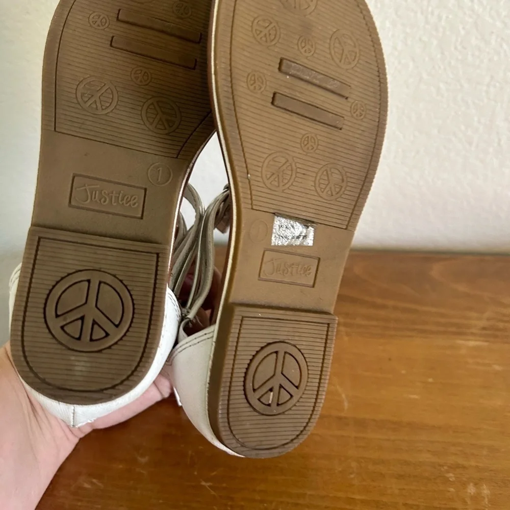 Youth size, one justice, gladiator, white, and silver sandals